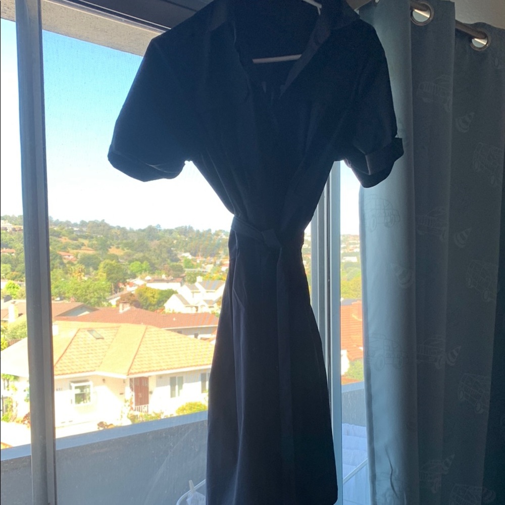 Button down shirt type navy blue dress with a wrap around vibe